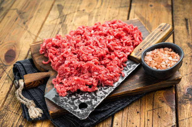istock Chopped ground beef and pork raw meat, mince on a cutting board, top view. 2188346422