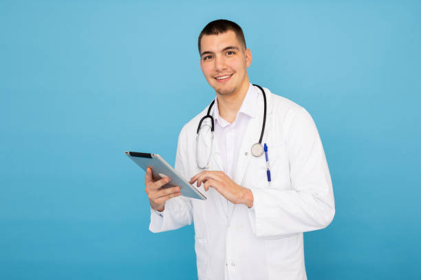 istock Young male doctor holding a tablet in his hands 2188346905