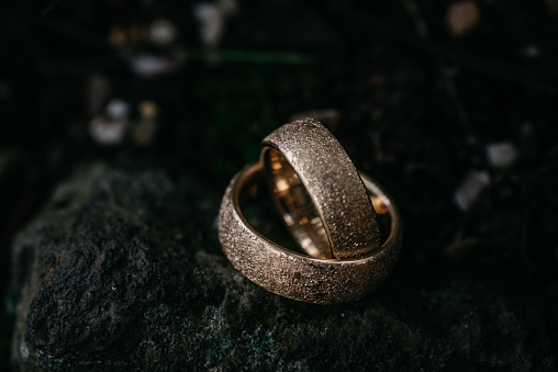 Dark Rings Texture Wedding Rings With Textured Surface On Dark Background Stock Photo ...
