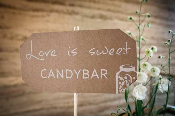 Rustic brown kraft paper sign with white calligraphy text reading \