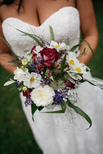 istock Rustic Wedding Bouquet Against White Bridal Dress 2188347990