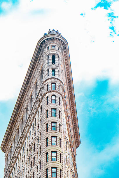 istock Iconic Architecture of Triangular Skyscraper Against Blue Sky Highlighting Historic Design and Urban Power in Metropolis Scene with Intricate Details and Beaux-Arts Style Showing Cityscape Elegance 2188348169