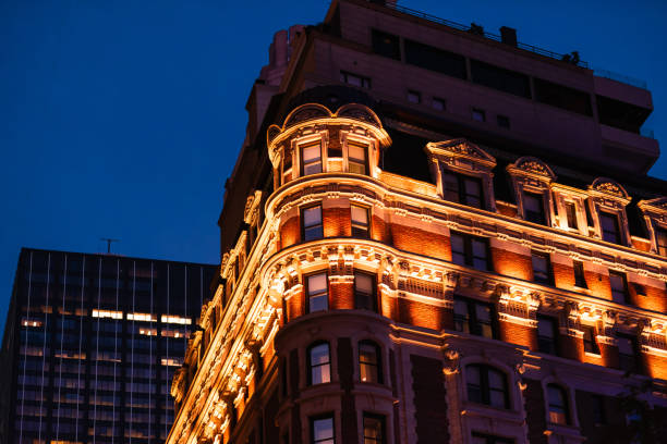 istock Illuminated Historic Building Facade Against Deep Blue Dusk Sky in Urban Setting with Artful Architectural Details and Warm Lighting Creating a Striking Contrast 2188349311