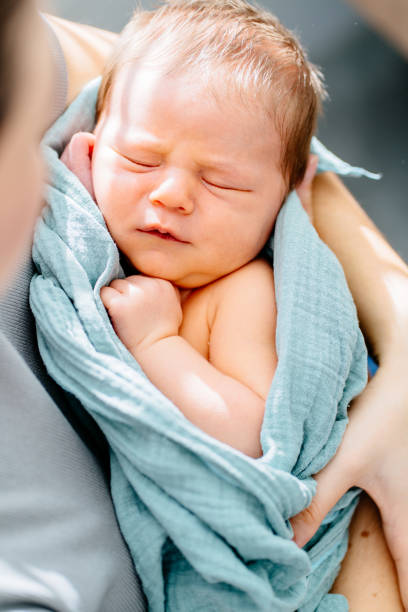 istock Peaceful newborn baby wrapped in soft blue blanket 2188349457