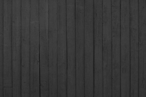 istock Distressed cracked wooden vertical black painted plank texture background 2188349620