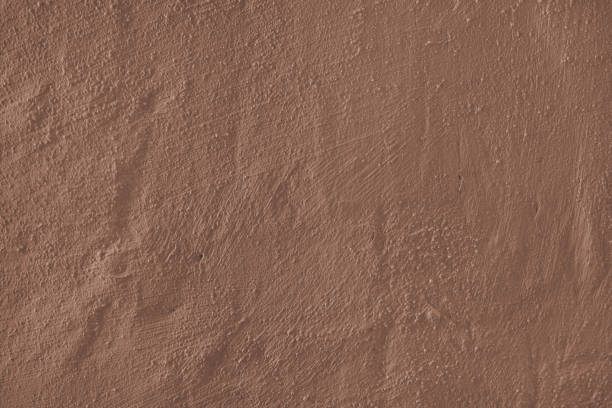 istock Textured brown plaster wall surface with brushstroke, painted, aged concrete background 2188349636