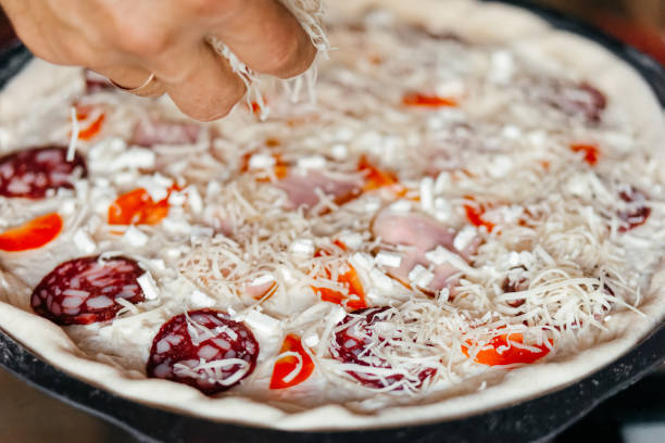 istock Making cooking pizza fresh ingredients homemade 2188351396