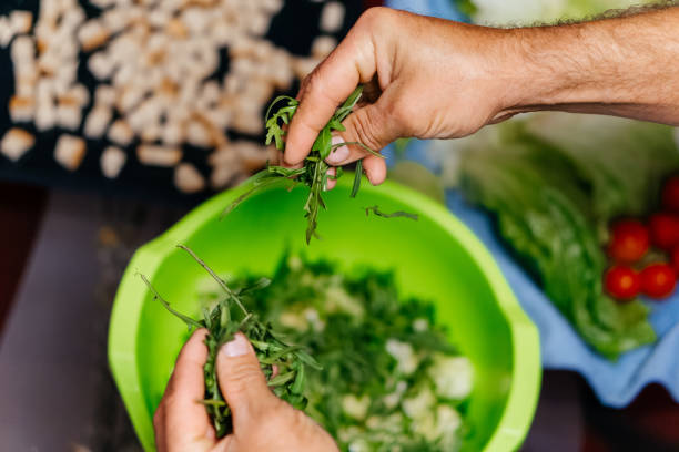 istock making salad home cooking with green plants 2188351498