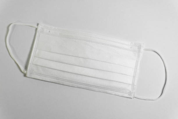 istock white disposable face mask isolated on white background. to protect from coronavirus 2188352196