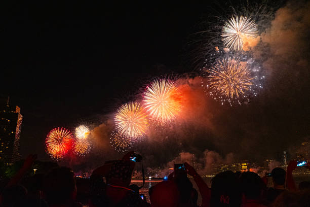 istock Spectacular Fireworks Display Over City Skyline Captured By Excited Crowd During Night Celebration, Vibrant Explosions Lighting Up the Sky Creating a Marvelous Display of Color and Joyous Atmosphere 2188352368