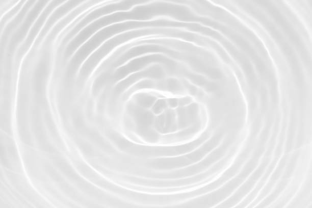 istock White water with ripples on the surface. Defocus blurred transparent blue colored clear calm water surface texture with splashes and bubbles. Water waves with shining pattern texture background. 2188356683