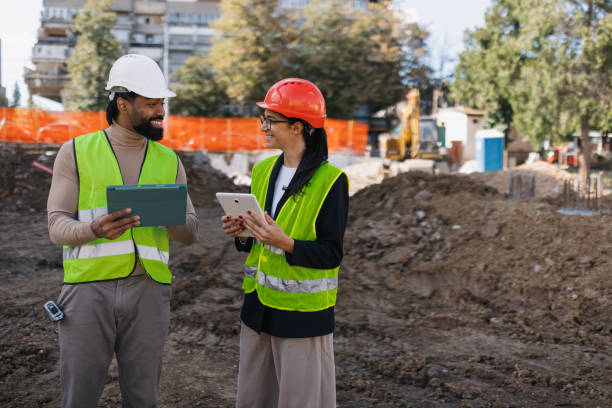 istock Cheerful team discussing building plans together 2188358650