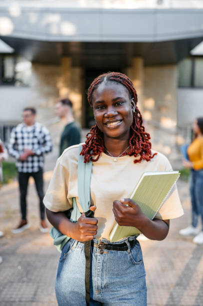 istock Young Woman Standing On The University Campus 2188359222