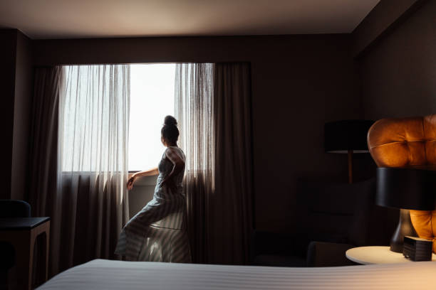 istock Woman in hotel room 2188360065