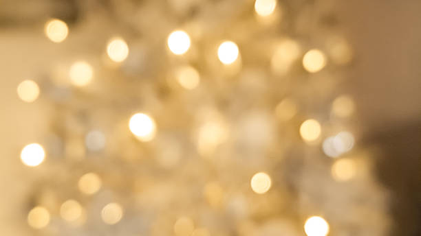 istock Classic blurred golden and brown bokeh with glowing Christmas light charm. 2188364480
