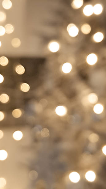 istock Classic blurred golden and brown bokeh with glowing Christmas light charm. 2188364582