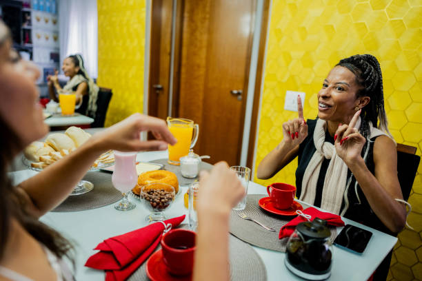 istock Female friends talking during breakfast at home 2188368448