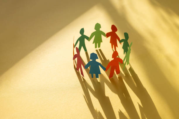 community of people holding hands standing together in circle, diversity