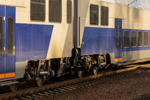 istock A sleek electric train approaches the platform, its modern design reflecting the soft sunray glow. Commuters eagerly await the arrival as the day begins 2188370233