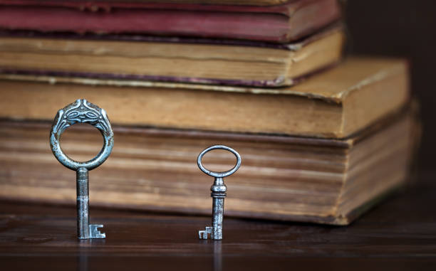 istock Old keys and books, escape room game background 2188373215