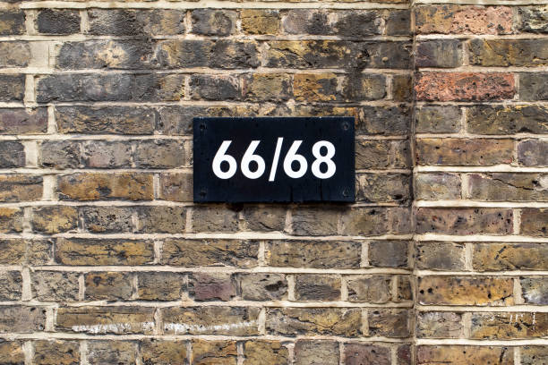 istock House number 66 and 68 on a brick wall 2188376640