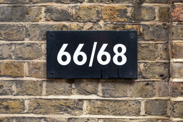 istock House number 66 and 68 on a brick wall 2188376641