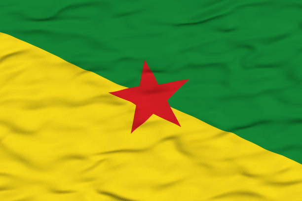 The regional flag of French Guiana depicted waving in the wind, featuring a diagonal split with green on the top, yellow on the bottom, and a red star at the center. The green represents the forests, yellow symbolizes the rich resources, and the red star signifies socialism and independence movements.