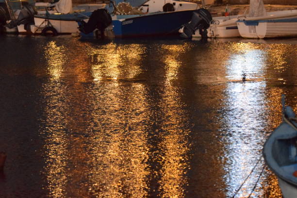 Night lights reflecting on the sea