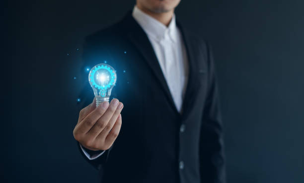 istock The idea of inspiration from online technology. innovation idea concept.with a light bulb And there is a gear icon in it And he is using a notebook computer. 2188377905
