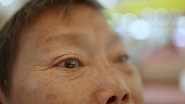 istock Asian elderly woman eats pumpkin bread with grains. 2188378664