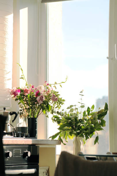 istock A beautiful vase of flowers sits by the kitchen window 2188379300