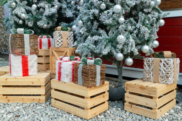 istock present boxes and Christmas tree in the outdoor at horizontal composition 2188381227