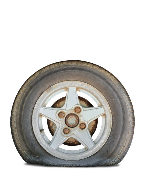 istock flat tire with rusty alloy wheel on white background. Clipping path 2188382582