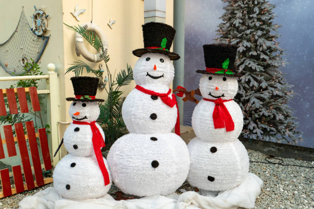 istock three big Christmas snowmen in the outdoor at horizontal composition 2188382724