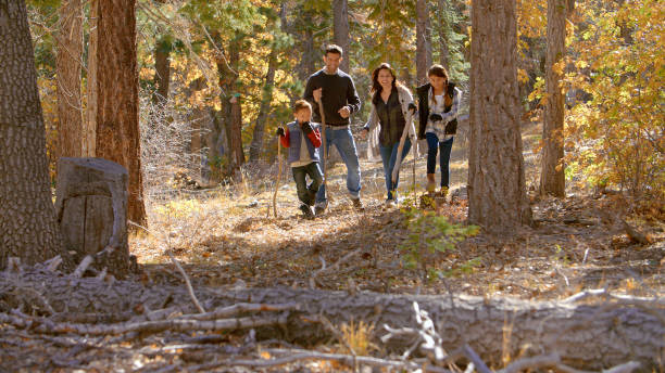 istock Active Family Outdoors Enjoying Autumn Or Fall Walk In Forest Together 2188384842