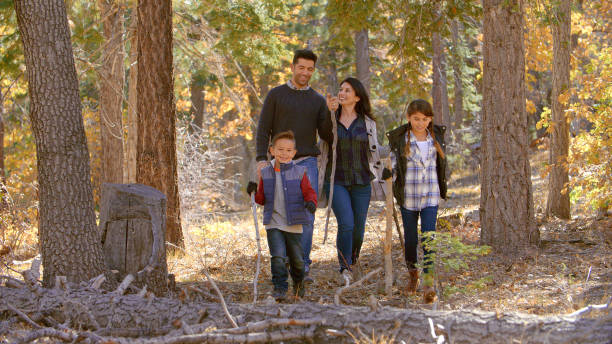 istock Active Family Outdoors Enjoying Autumn Or Fall Walk In Forest Together 2188385007