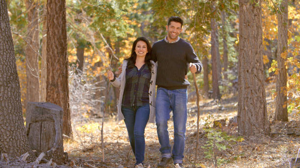 istock Active Mature Loving Couple Outdoors Enjoying Autumn Or Fall Walk In Forest 2188385022