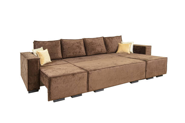 istock Brown unfolded sofa with velor fabric pillows isolated on a white background. Cushioned furniture. 2188385031