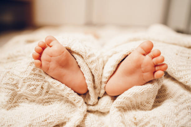 A close-up of tiny baby feet