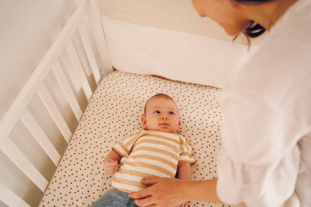 istock Little baby enjoy with mother 2188385850