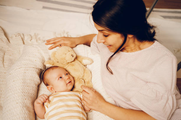 istock Little baby enjoy with mother 2188385873