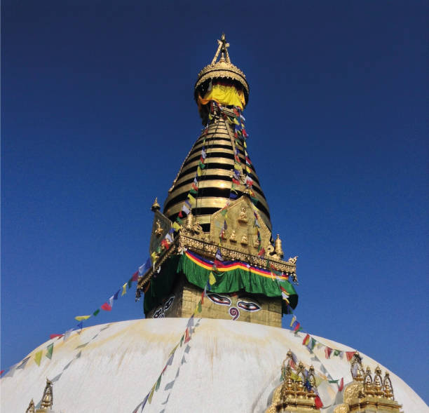 Young Caucasian woman standing on the background of Buddha stupa in Kathmandu