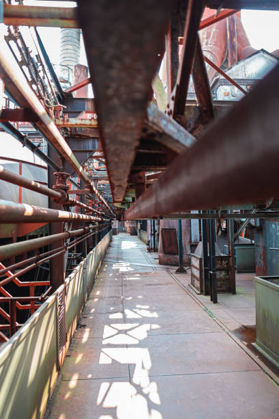 istock Abandoned Industrial Complex With Rusty Metal Pipes and Structures in Urban Environment Highlighting Decay and History 2188388075