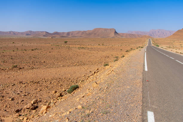 Long road through the Moroccan desert along the Atlas Mountains