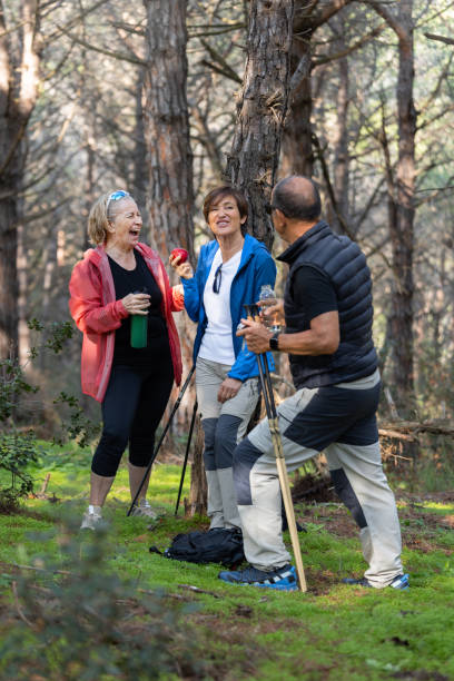 istock Group of Senior Friends Taking a Break While Hiking in the Forest 2188388916