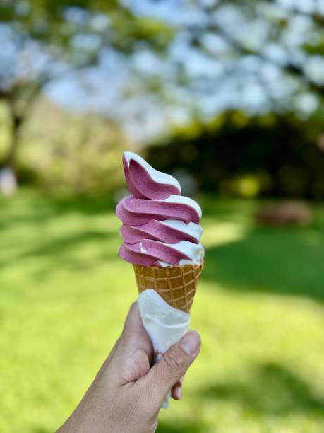 istock Ice cream cone strawberries in a garden with big trees 2188389659