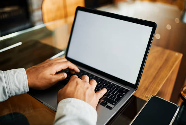istock Close-Up of Hands Typing on Laptop with Blank Screen 2188392570