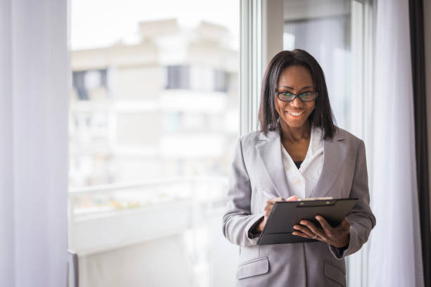 istock Business woman taking notes and smiling 2188393295