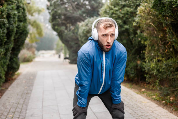 istock Morning Runner Taking a Break in Misty Park 2188393690