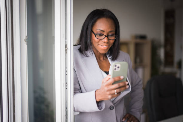 istock Business woman text messaging 2188393738